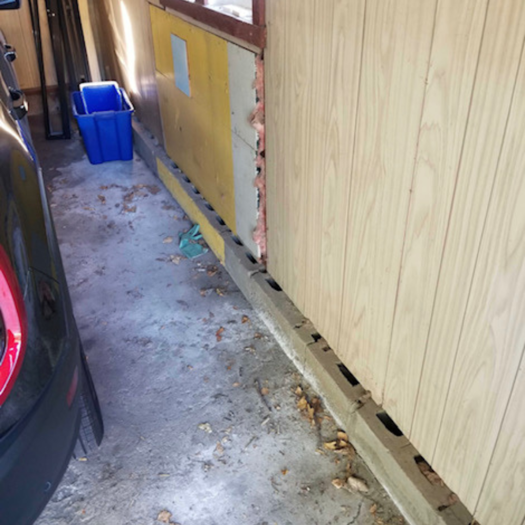 Mouse entry point of open cinderblocks inside garage
